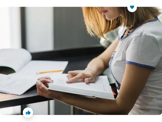 woman reviewing a manual document